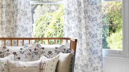 living room with white printed tie top curtains