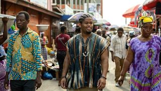 Isaiah John as Leon walking the streets of Ghana in Snowfall season 6 episode 3
