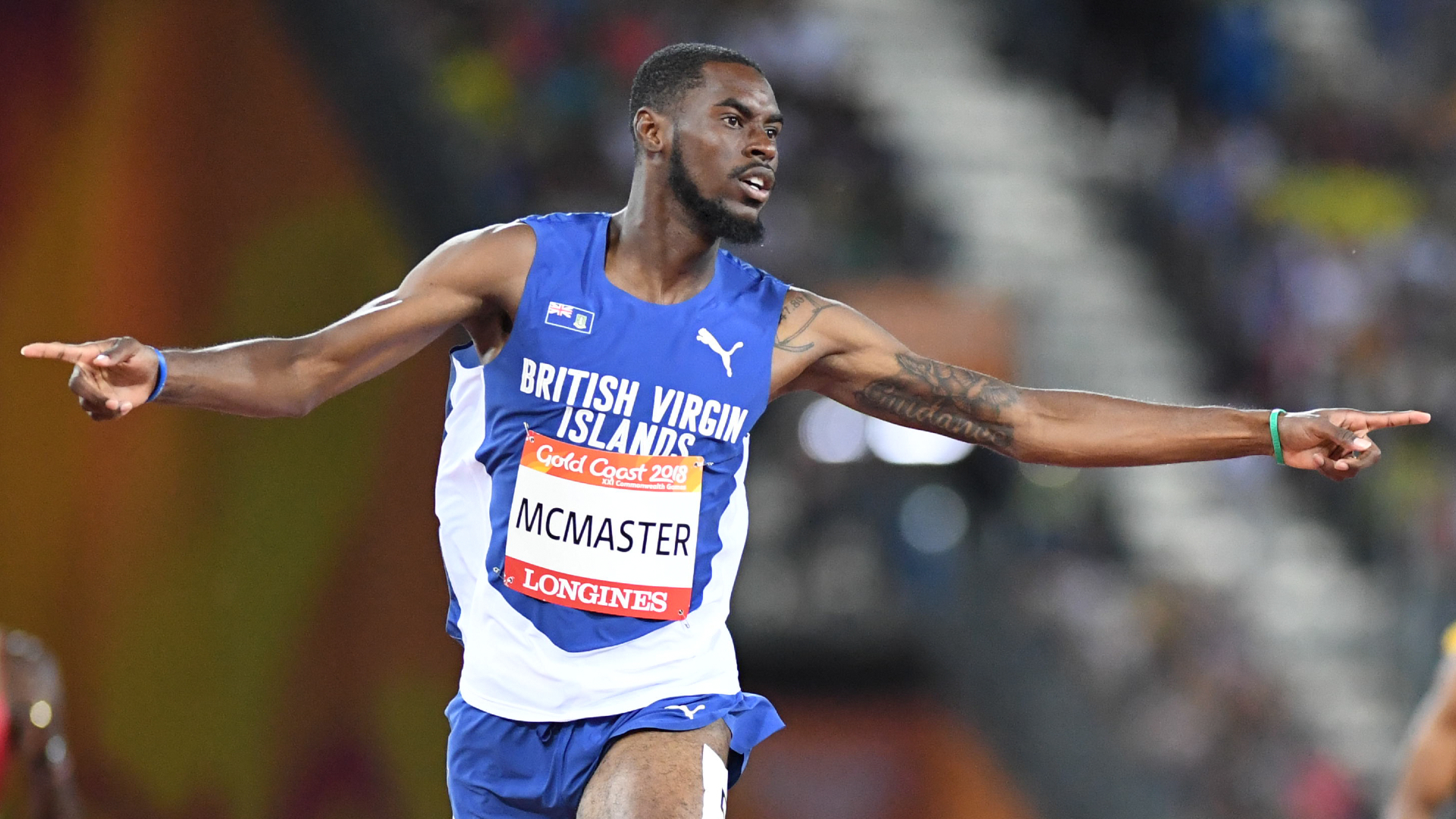 Kyron McMaster celebrates the 400m hurdles win at 2018 Gold Coast Commonwealth Games.