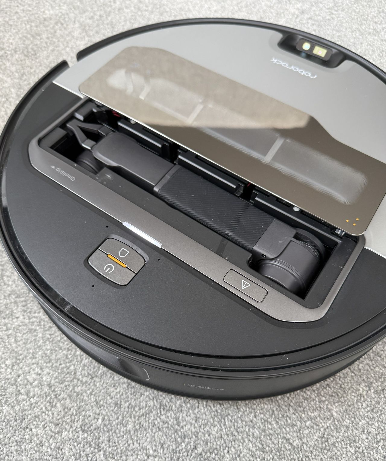 Above photograph of the Roborock Saros Z70, showing the robotic arm revealed by open hatch