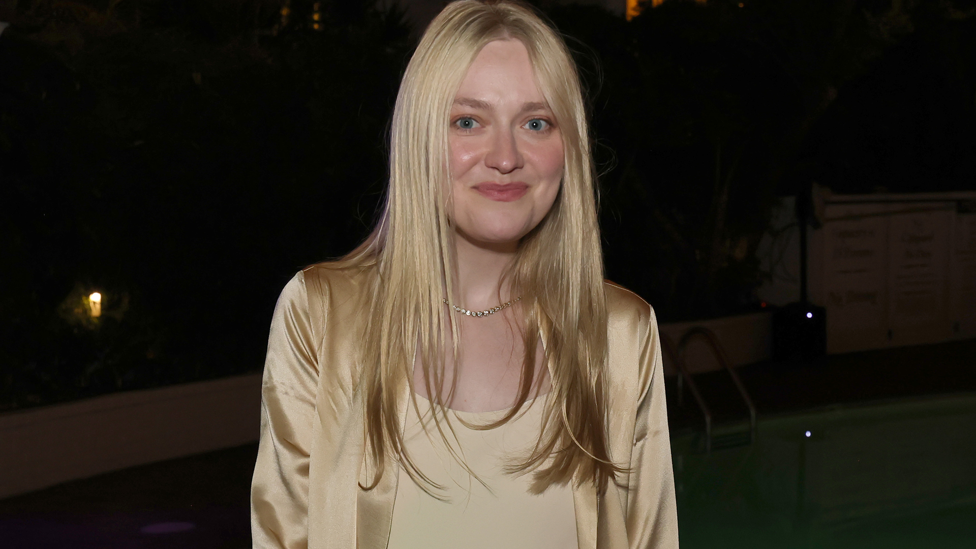 Dakota Fanning styled a slip dress and a matching silky robe with the heeled flip-flops trend 