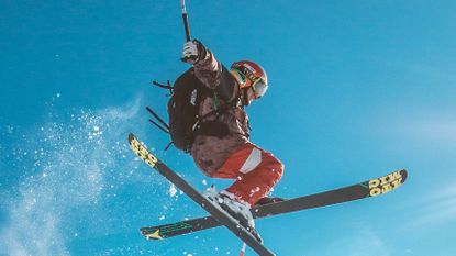 best ski gloves: Skiier on a jump