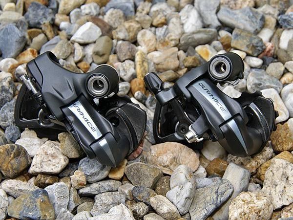 In fact, the two rear derailleurs look strikingly similar from the upper knuckle forward.
