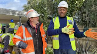 Chris Frediani and Colin Salmon in hard hats on site in DIY SOS: EastEnders