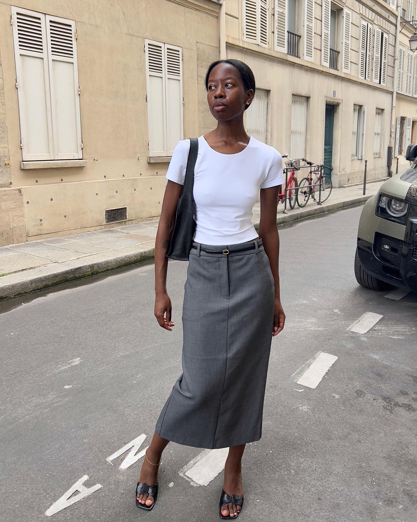 Sylvie Mus styles a grey pencil skirt with a whit t-shirt and mules.