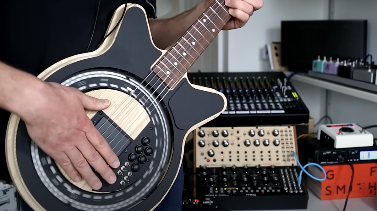 A screengrab from a Circle Instruments video demonstrating the company&#039;s self-strumming MIDI controllable Circle Guitar