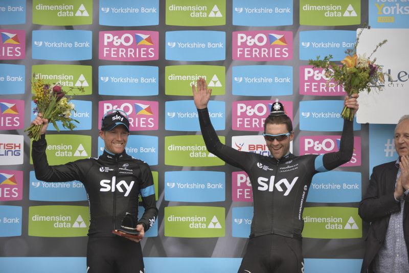 Nathan Earle tries on a police custodian helmet on the podium