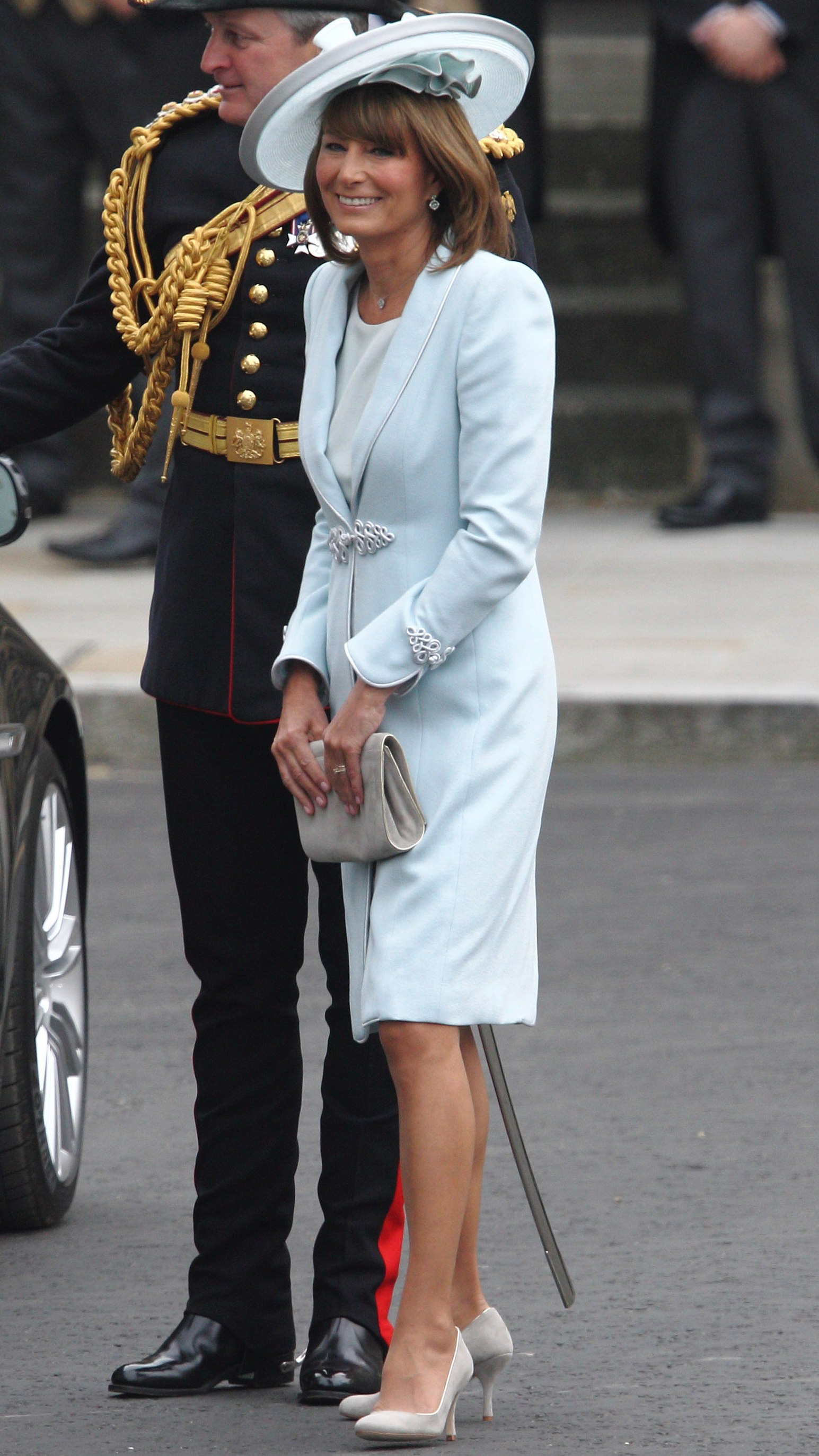 Carole Middleton smiles as she arrives for the Prince and Princess of Wales's wedding
