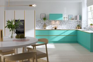 bright colourful with with a matching cooker hood and terrazzo splashback