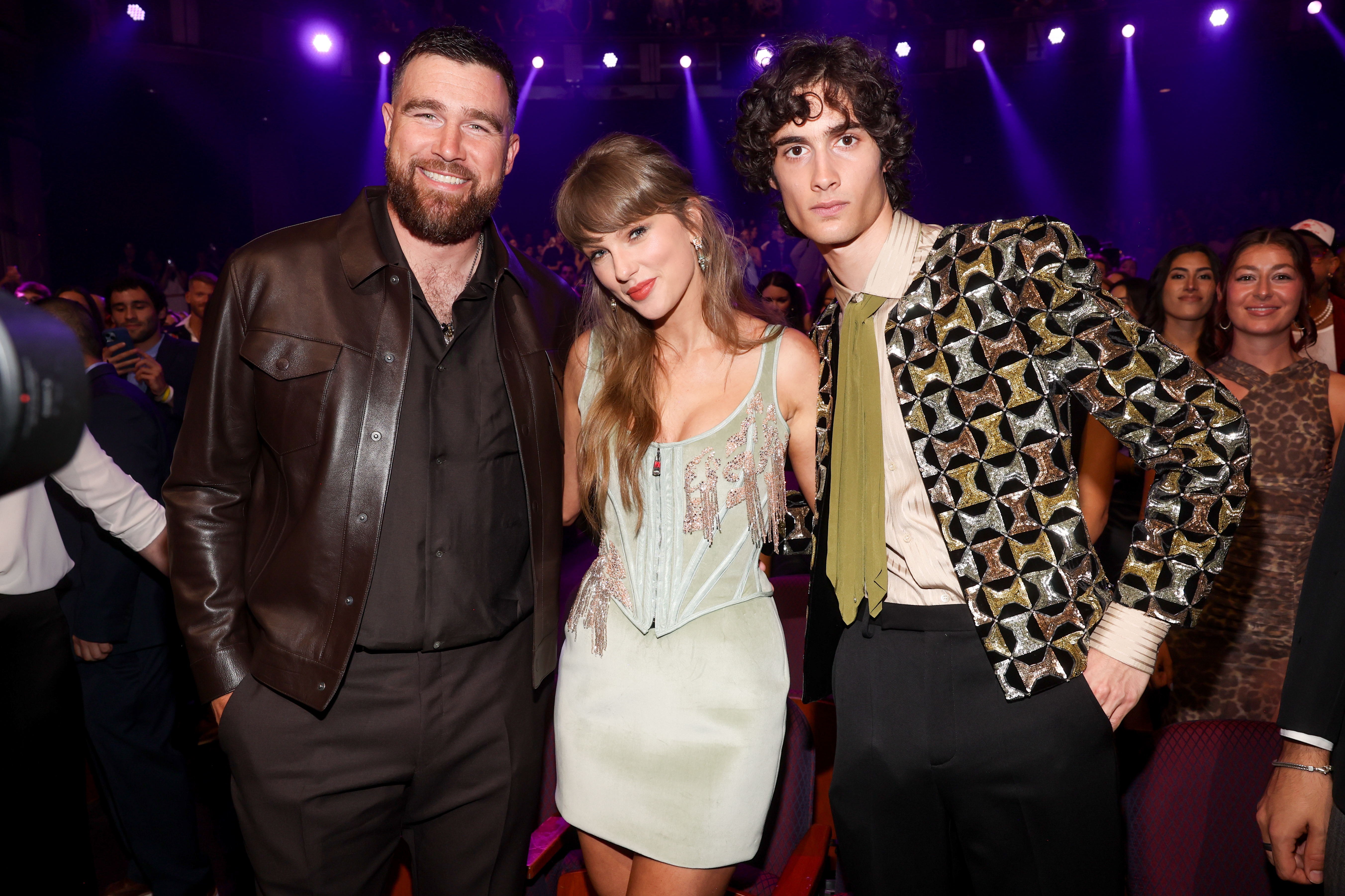 Taylor Swift and Travis Kelce inside the iheartradio music awards with Sombr