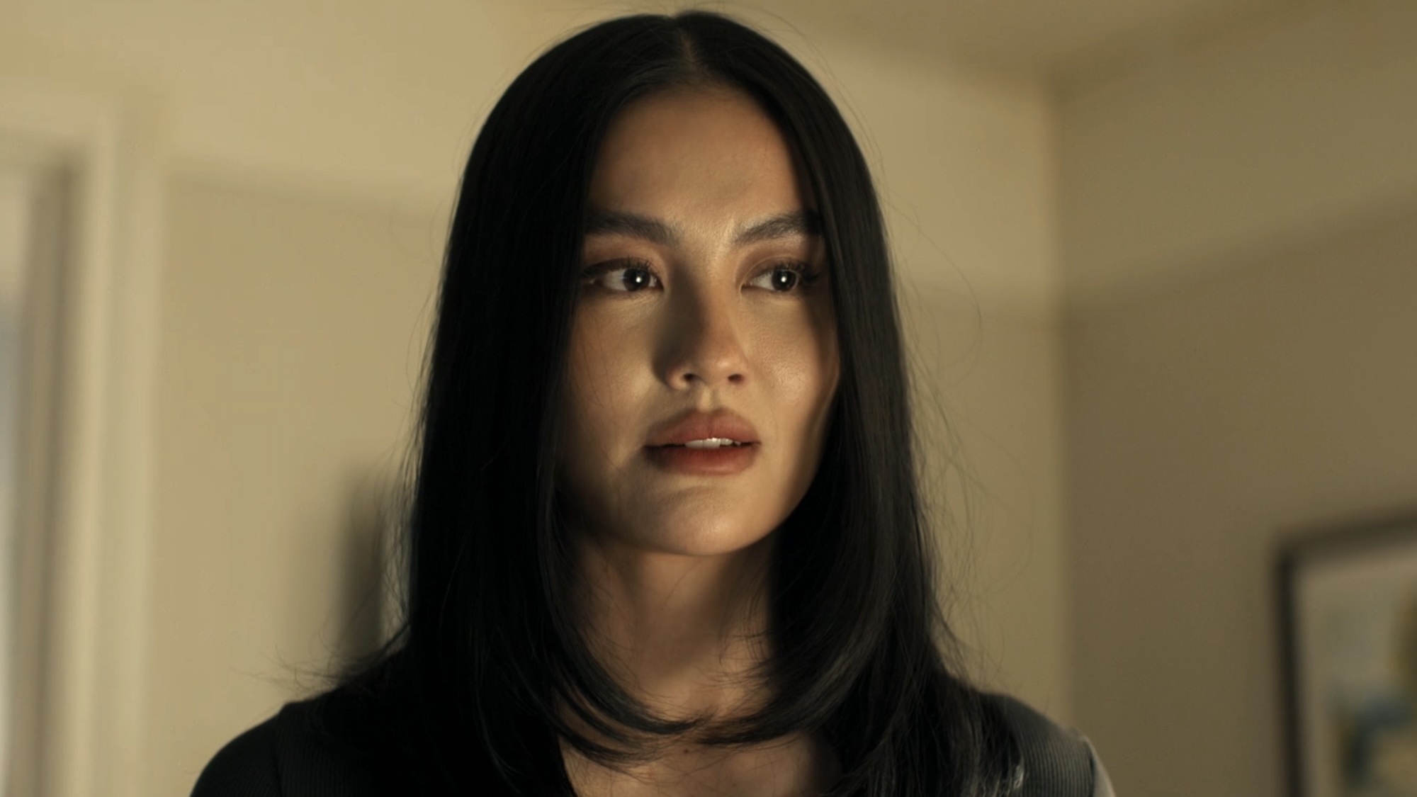 Lila standing in hotel room in Reacher Season 4