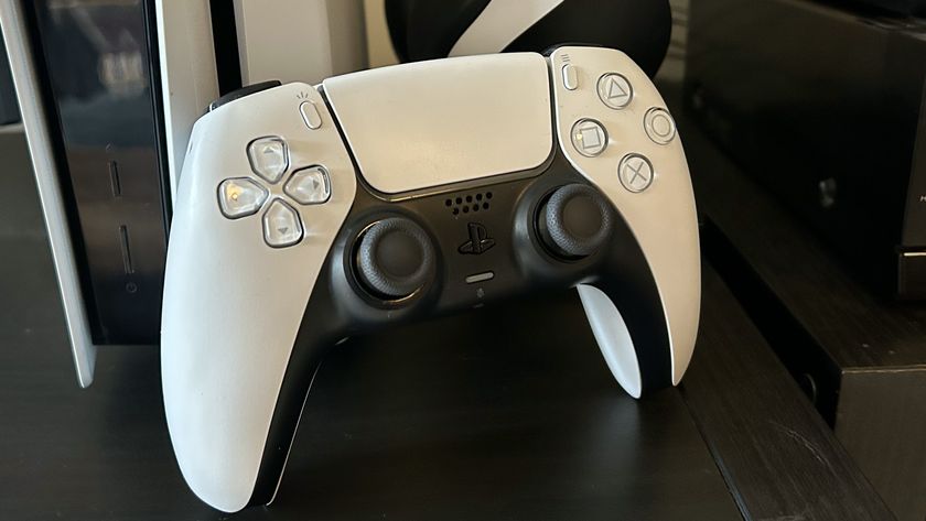 Sony DualSense controller upright standing against a PS5 console and Pulse 3D headset