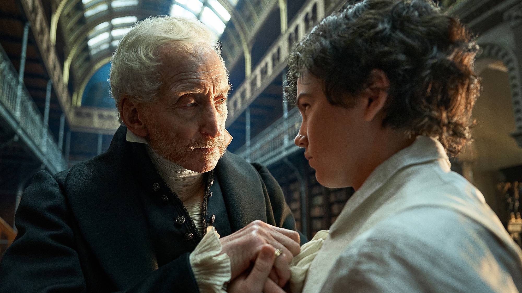 Charles Dance as Leopold Frankenstein and Christian Convery as Young Victor in "Frankenstein" on Netflix