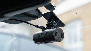 Thinkware F70 dash cam mounted on a windscreen