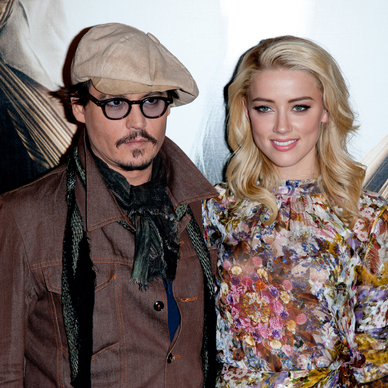 Johnny Depp and Amber Heard 2011 posing for Rhum Express photocall