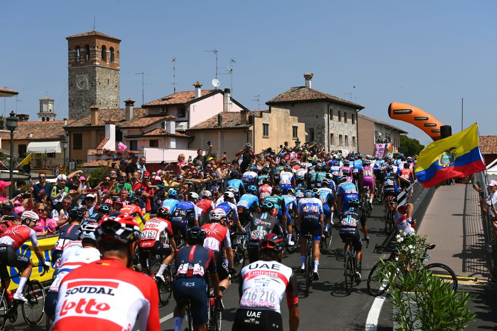 SANTUARIO DI CASTELMONTE ITALY MAY 27 A general view of the peloton at Marano Lagunare start village while fans cheer prior to the 105th Giro dItalia 2022 Stage 19 a 178km stage from Marano Lagunare to Santuario di Castelmonte 577m Giro WorldTour on May 27 2022 in Santuario di Castelmonte Italy Photo by Tim de WaeleGetty Images
