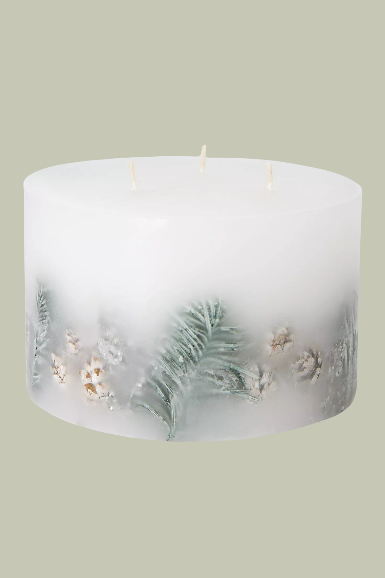 A white inclusion candle with three wicks