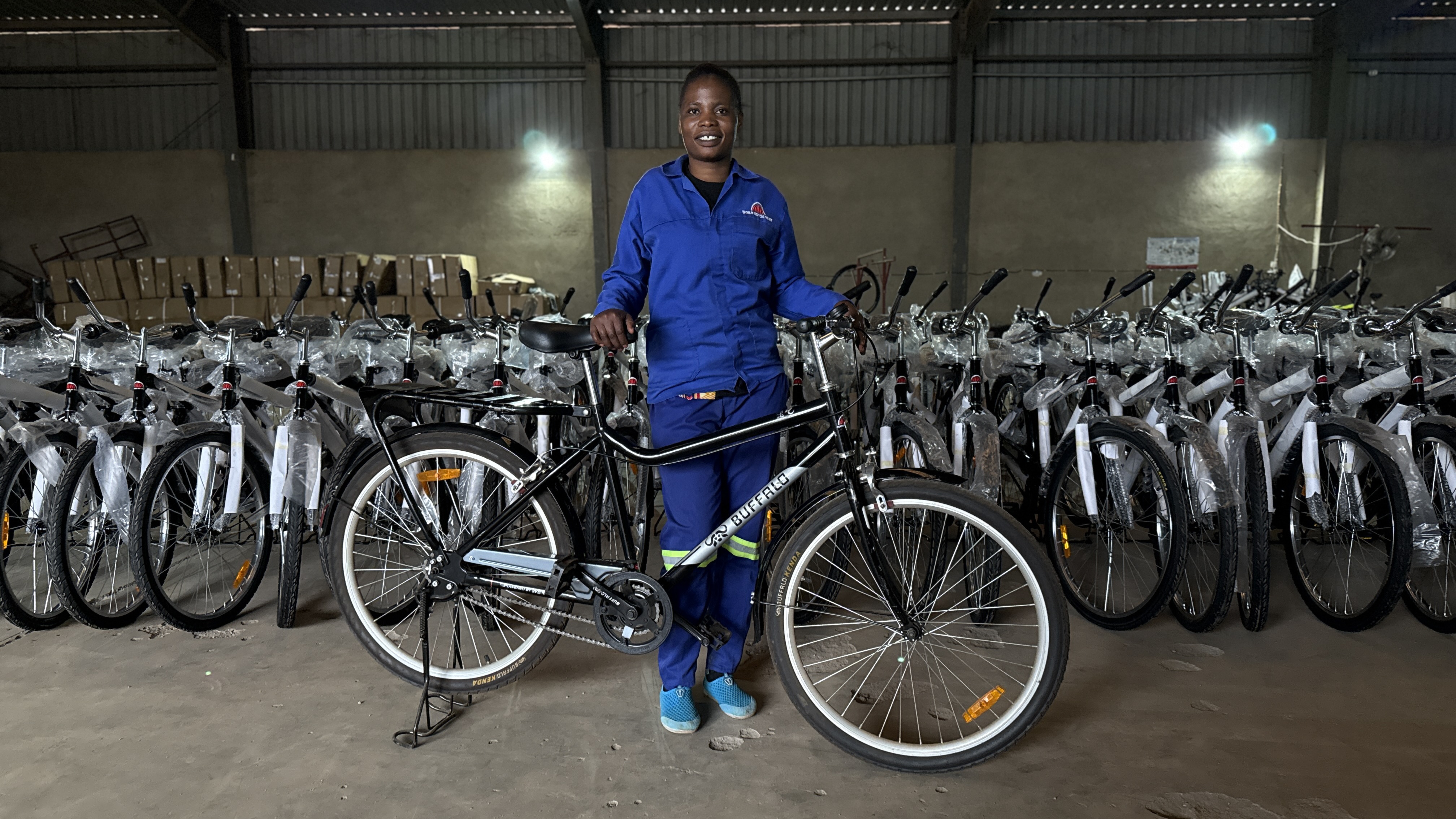 WBR worker with Buffalo Bikes