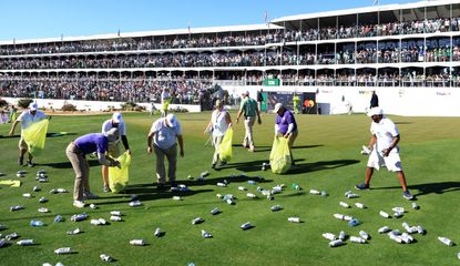 Volunteers clear beer at the 16th