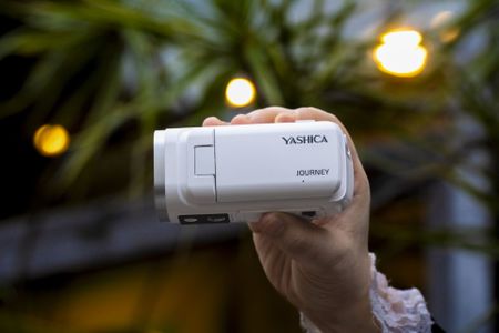 Yashica Journey 4K camcorder in white, in user's hand