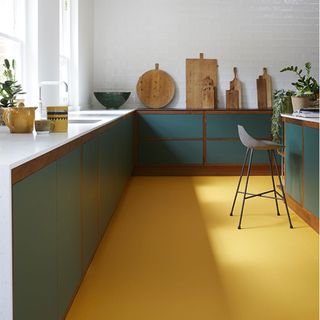 kitchen with yellow floor and cabinets