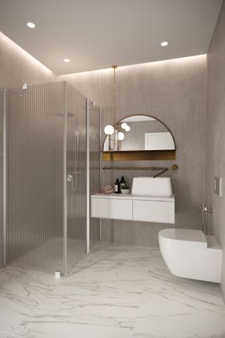 A shower with fluted glass panels and marble effect flooring