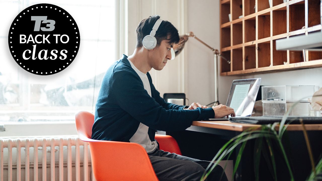 T3 Back to Class 2023 - student wearing headphones while using a laptop on a desk