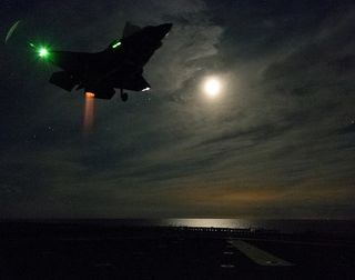 f-35b vertical night landing at sea