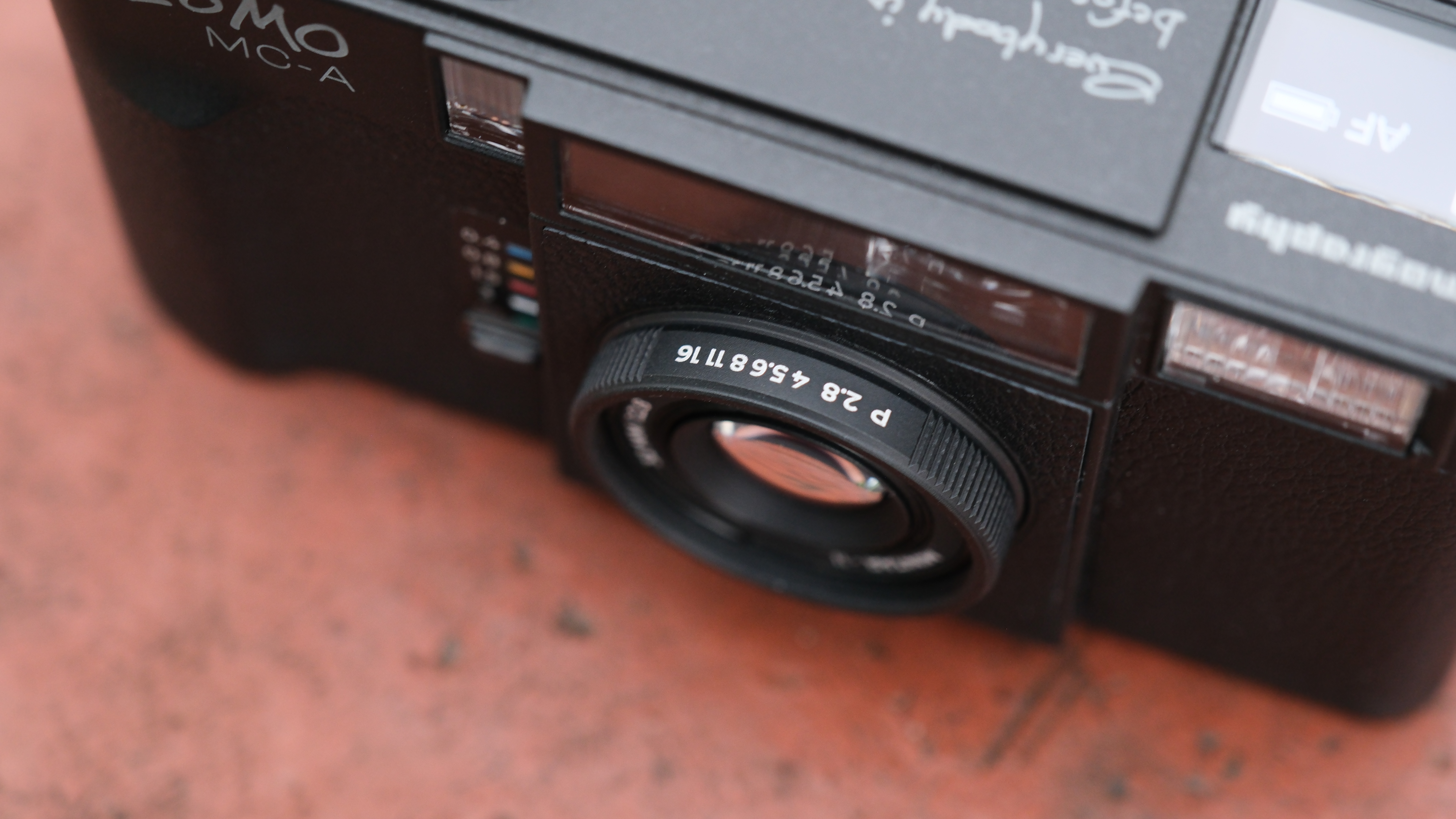 Close-up of the aperture dial on the lens of a Lomography Lomo MC-A camera