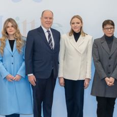 Prince Albert and Princess Charlene posing with Princess Stephanie and Camille Gottlieb