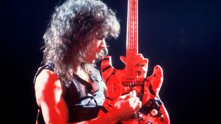 Eddie Van Halen (1955 - 2020), of the group Van Halen, performs onstage at the Aragon Ballroom, Chicago, Illinois, March 4, 1978.