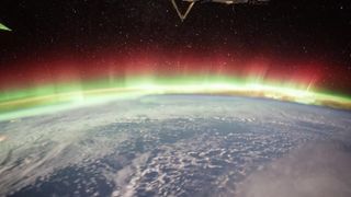 The aurora borealis, as seen from the International Space Station. A lesser-known type of aurora -- called isolated proton auroras -- may be blasting ozone holes into Earth's atmosphere.