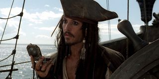 Jack Sparrow with compass in pirates of the caribbean the curse of the black pearl