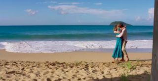 Martha and Humphrey kiss on the beach