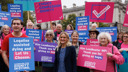 Labour MP Kim Leadbeater stands in front of campaigners for the assisted dying bill 