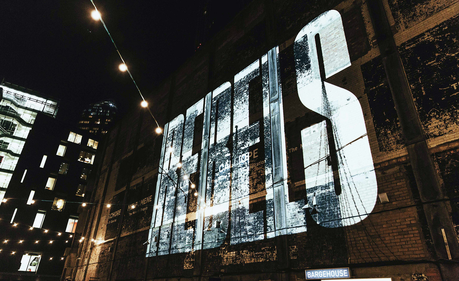 The Bargehouse on London’s South Bank is lit up with the exhibition’s title