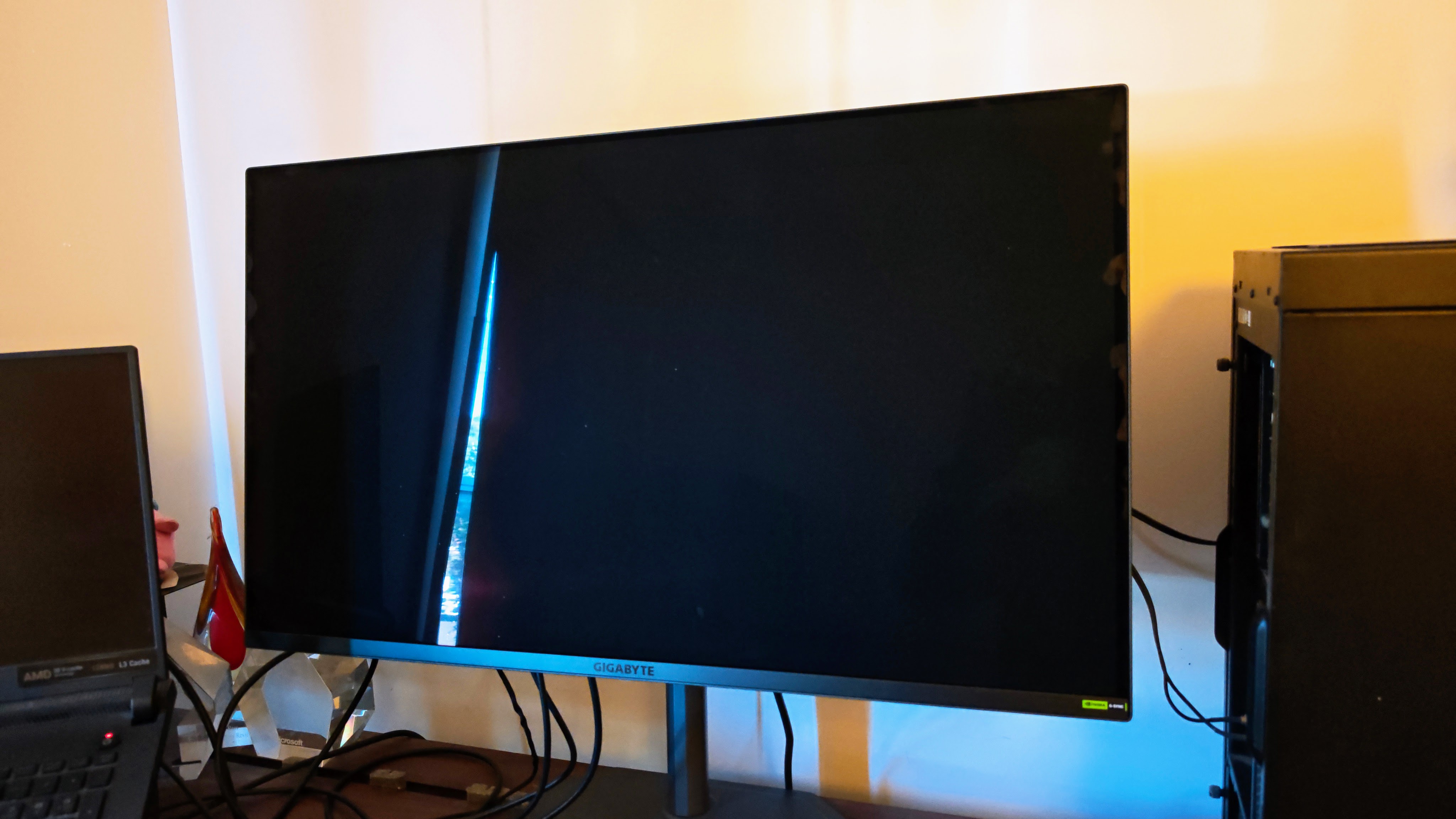 Gigabyte MO32U24 gaming monitor display off showing reflections