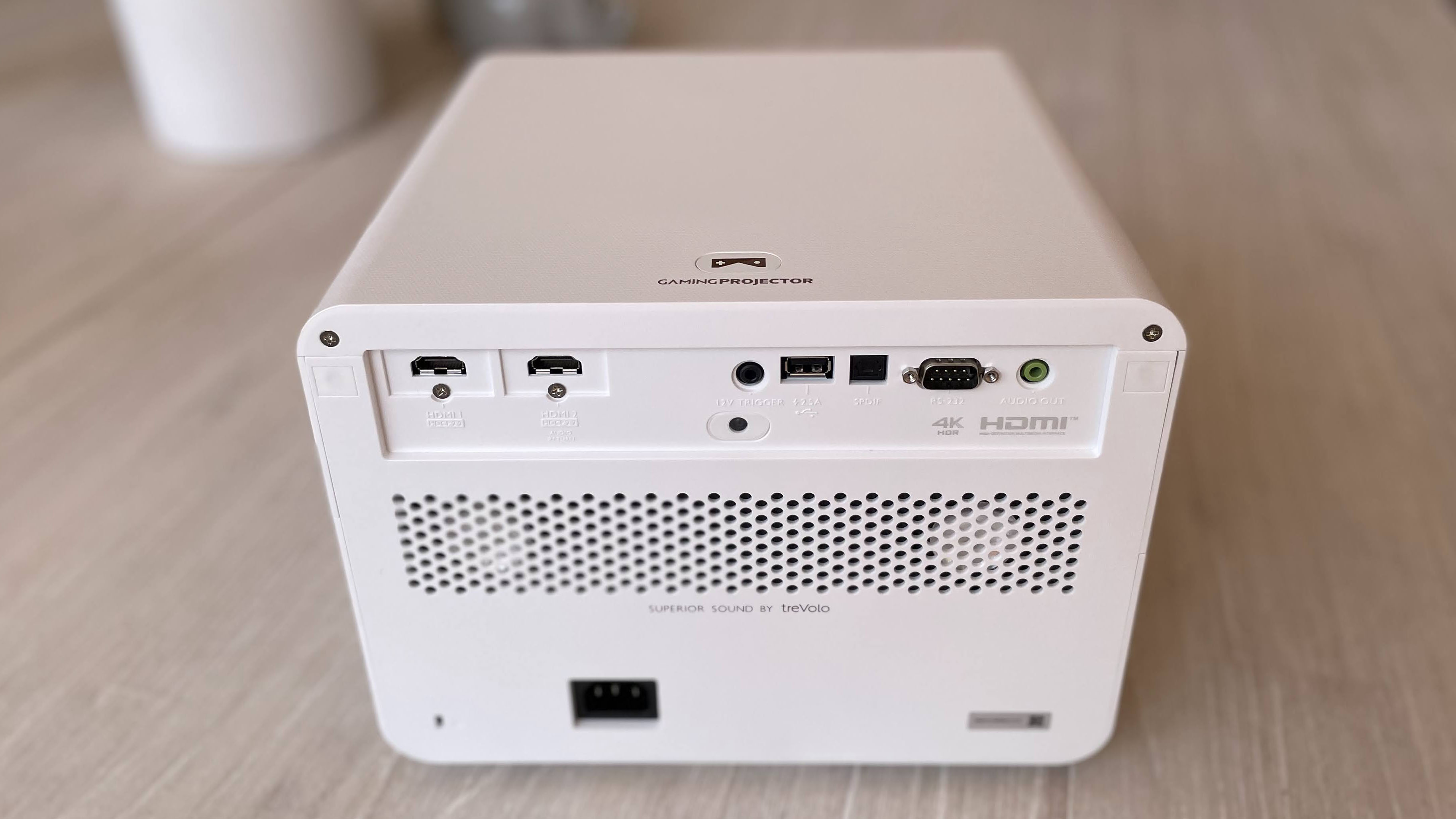 The rear panel of the BenQ X3000i gaming projector with all its ports and speaker grille.