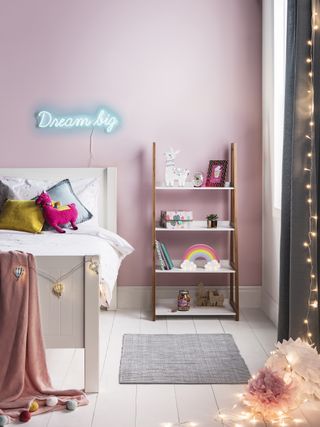 Pink kids bedroom with neon lights