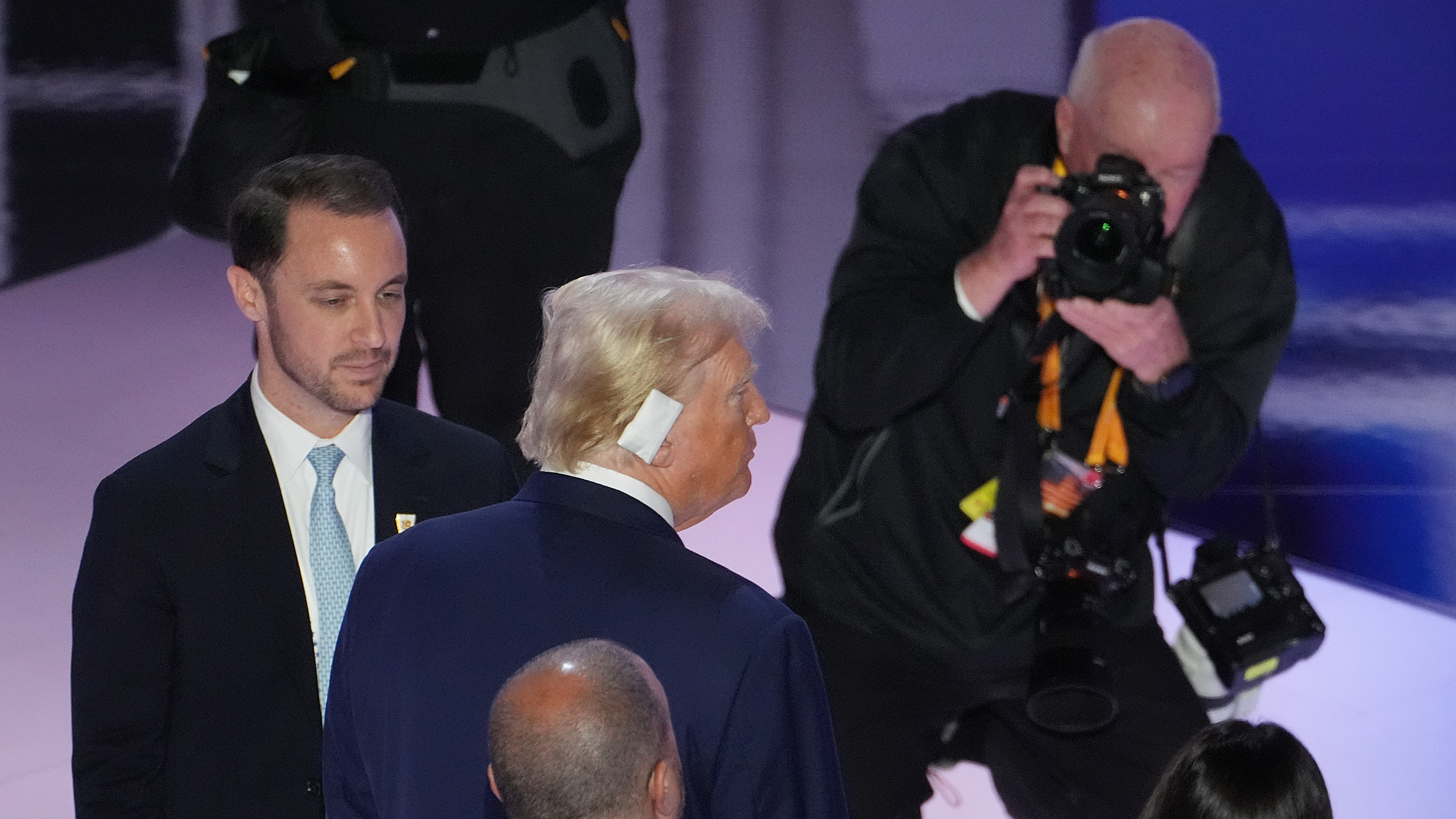 Photographer Doug Mills takes a photograph of Donald Trump