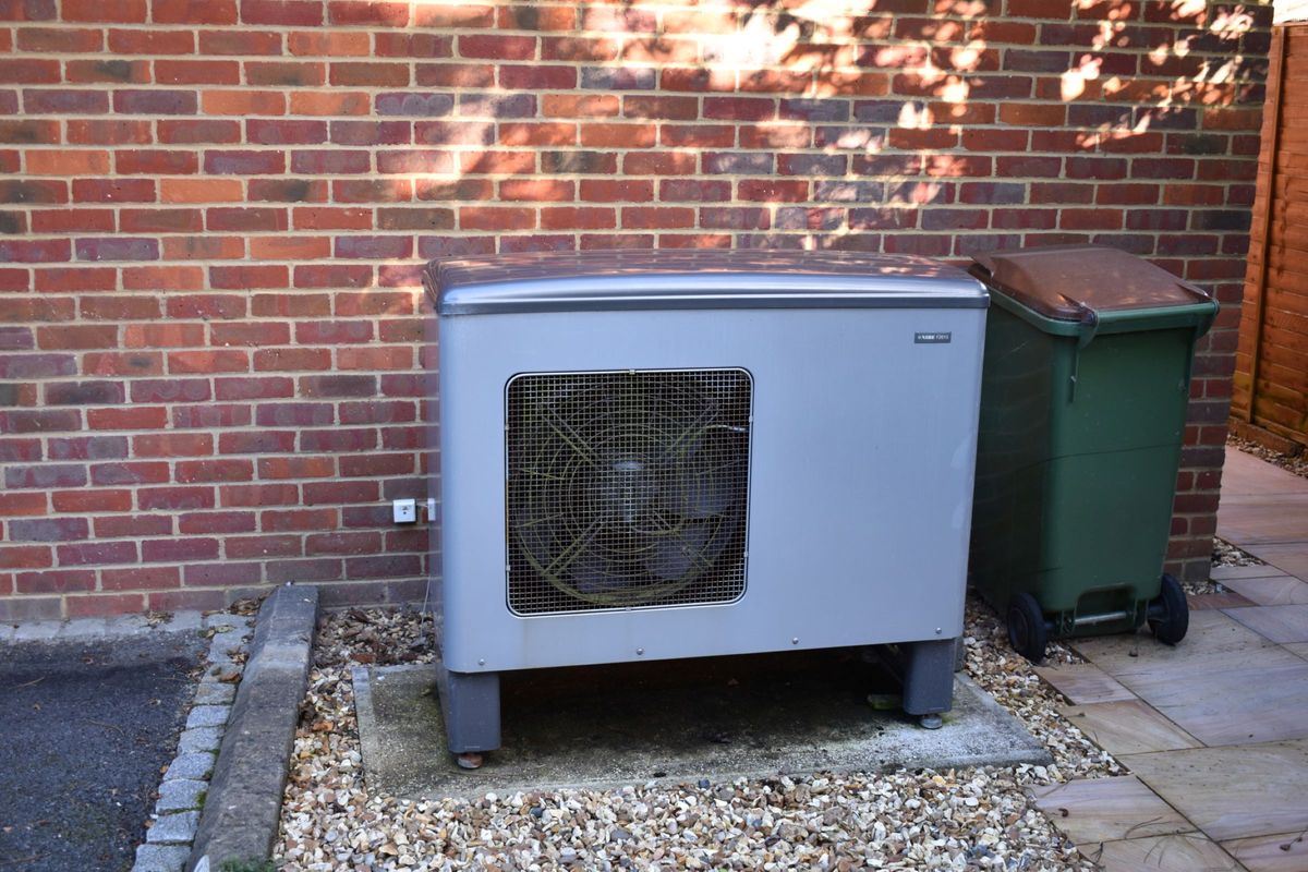 A air source heat pump at the back of the house