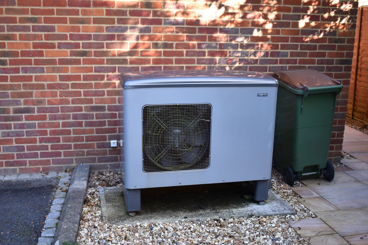 A air source heat pump at the back of the house