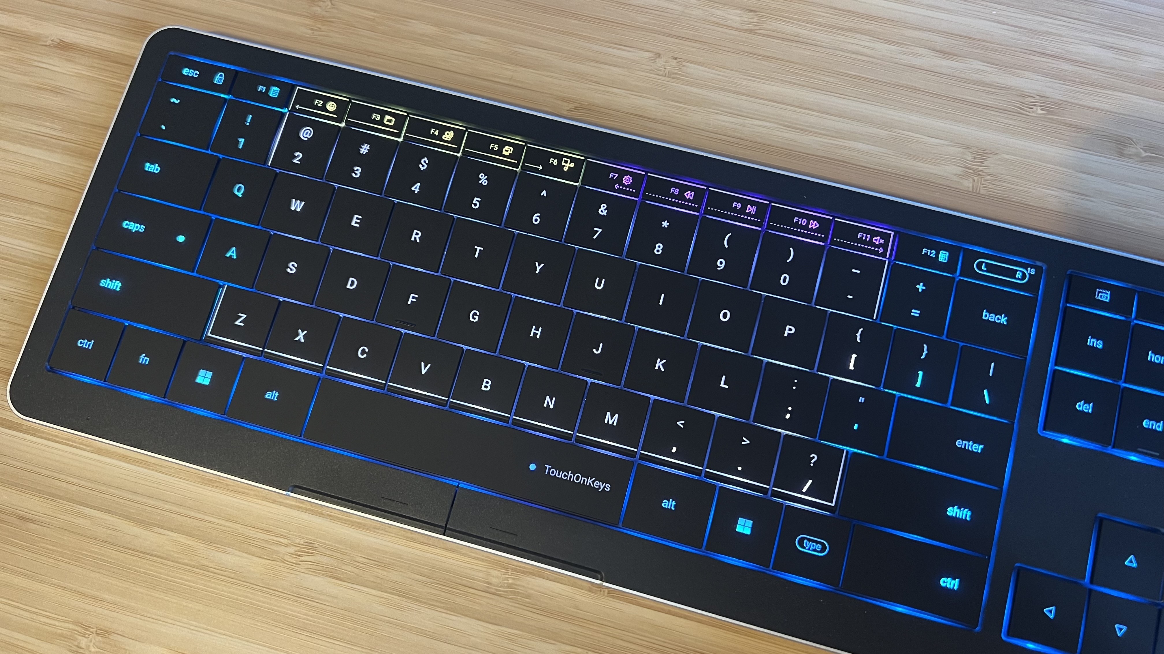 CLVX keyboard on a wooden desk