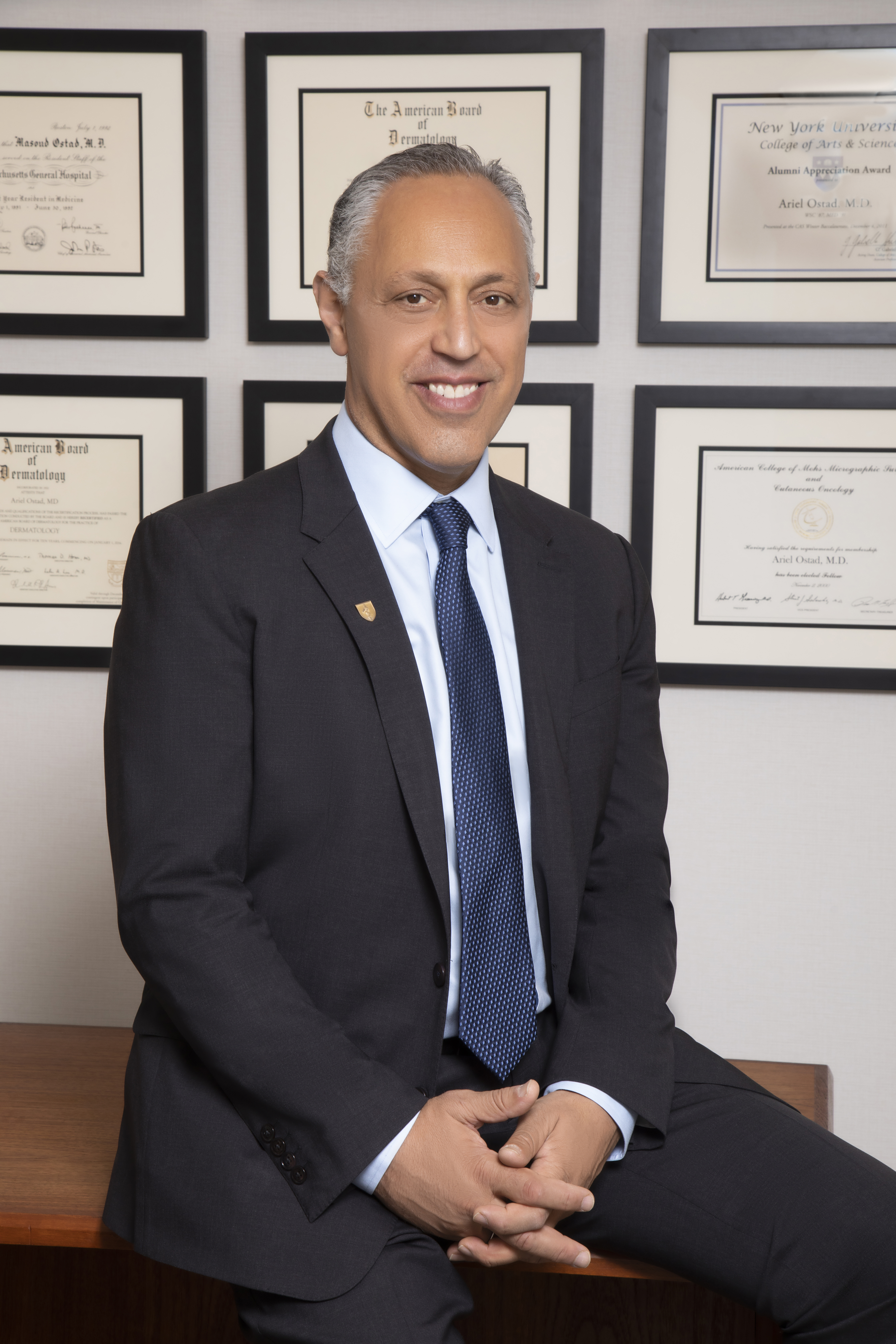 Dr. Ariel Ostad in a black suit