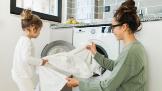 A woman and her daughter sorting the laundry