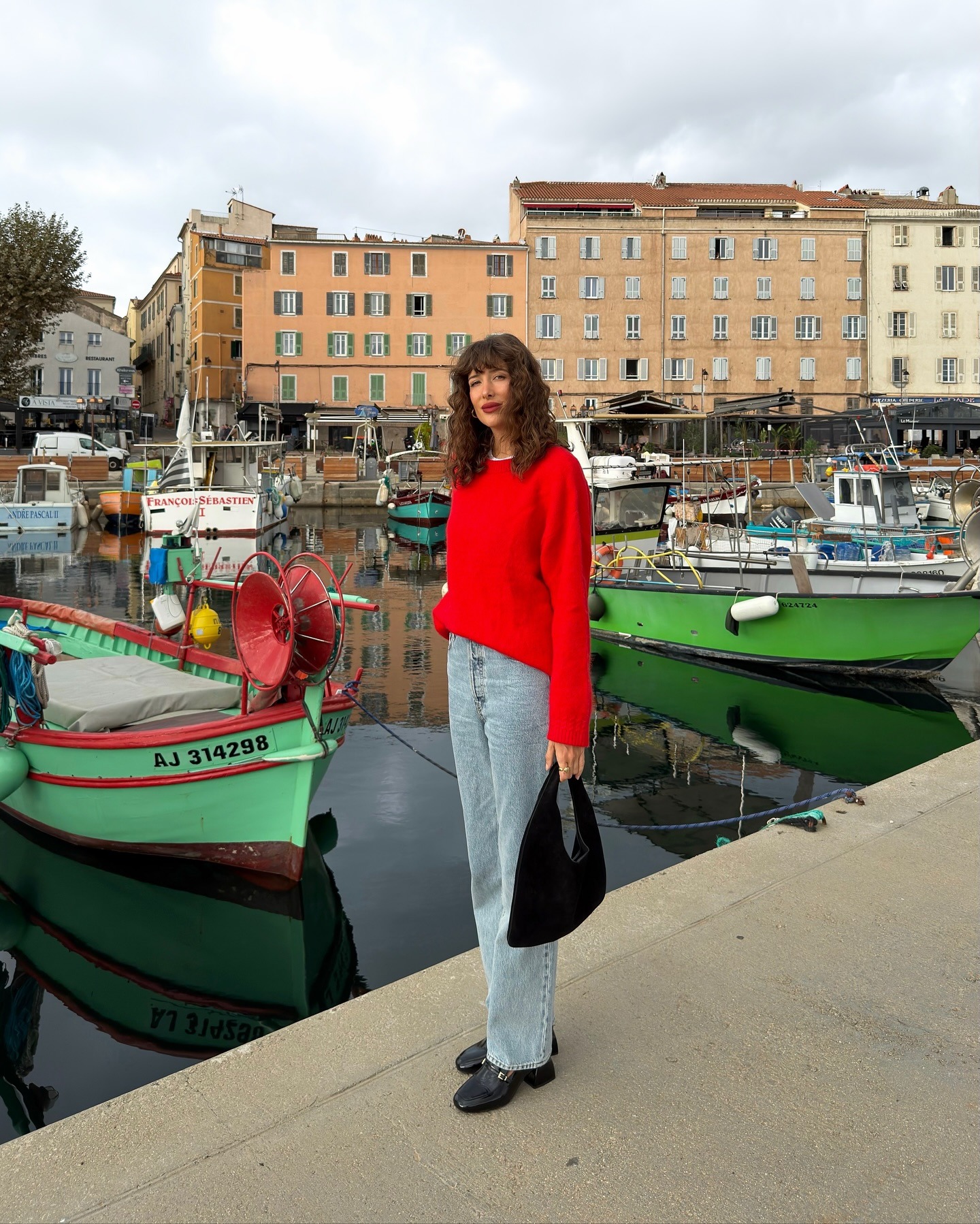 Influencer wearing light-wash jeans and heels