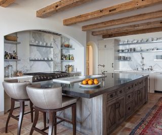 Tuscan kitchen with reclaimed ceiling beams and Italian Calcutta marble