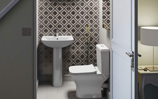 Understairs toilet idea with geometric tiling feature wall