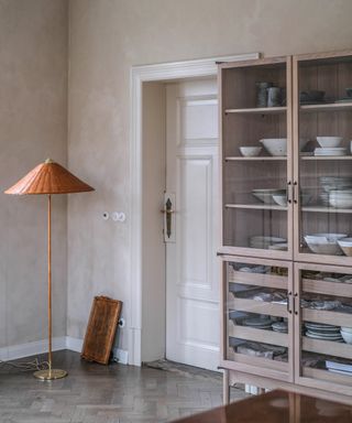 Rustic style kitchen with limewashed walls and painted cabinetry