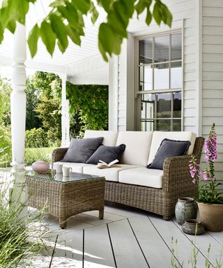 Rattan furniture on a wooden porch